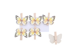 Papillon sur une pince jaune