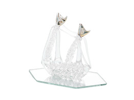 Glass boat on mirror